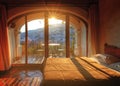 View of the city on the slopes of the mountains through the window of the hotel.