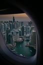 a view of a city at sunset from an airplane window Royalty Free Stock Photo