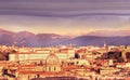 View of the city at sunset. On the horizon tops of mountains in the snow. Rome.