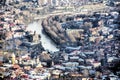 View of the city of Tbilisi, its tiled roofs and colorful houses from the viewpoint of the hill