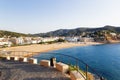 View of the city of Tossa de Mar in Spain from the walls of an old castle by the sea in the early morning.