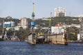 View of the city of Vladivostok and and a floating dock `Dalzavod` at the pier from the side of the Golden Horn Bay. Far East Royalty Free Stock Photo