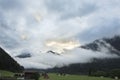 View cityscape and landscape of Pfunds city with grass field and mountain in Tyrol, Austria Royalty Free Stock Photo