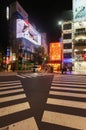 View of cityscape at night with colorful advertisement billboard light beside the street