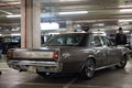 view of a classic silver colored Dodge 3700 at a rally of sports and tuned cars