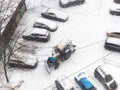 View of cleaning of parking area with tractor snow Royalty Free Stock Photo