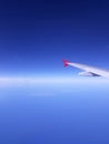 The view of the clear blue sky from inside the airplain.