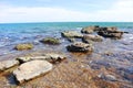 View of clear blue water and stones in the sea in sunny day Royalty Free Stock Photo