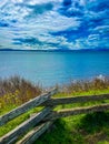 View of the clear sea, wooden fence along the shore Royalty Free Stock Photo