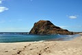 A View of a Cliff at the end of a Sandy Coastline