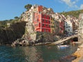 View from the cliff over the sea of Riomaggiore, colors reflected in the water Royalty Free Stock Photo