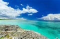 View from a cliff on tranquil turquoise ocean against blue sky magic background at Cayo Coco Cuban island on sunny nice day Royalty Free Stock Photo