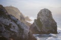 View of the cliffs of Cape Roca and the ocean surf during sunset. Sintra, Portugal.