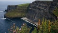 view of the Cliffs of Moher in Ireland with rugged coastline and cloudy sky Royalty Free Stock Photo
