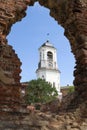 View of the Clock Tower through the ancient ruins of the cathedral. Vyborg