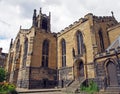 View of the clock tower and building of the historic saint peters parish church in the center of huddersfield against a cloudy sky Royalty Free Stock Photo