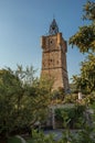 View of the clock tower made of stone on top of the hill with vegetation in Draguignan. Royalty Free Stock Photo