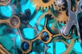 The view is close. Mechanism of a wristwatch. Gears, levers, springs and gems. Engraving and gold. old scratched glass. Concept of