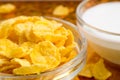 View close-up of milk and a glass bowl of cornflakes