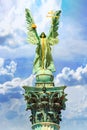 View closeup of the top of the column with statue Archangel Gabriel, who holds the Hungarian Holy Crown, in Budapest