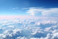 A view of the clouds from an airplane window. Blue cloudy sky, above the clouds