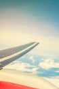 View of clouds and sky. aircraft wing from the window, tinted photo Royalty Free Stock Photo