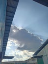 view of cloudy clouds between buildings in Kartasura