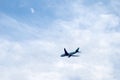 Airplane Flying Under The Moon Royalty Free Stock Photo