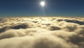 View of a cloudy sunrise while flying above the clouds.
