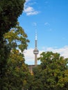 View on the CN Tower with trees on the foreground