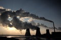 View of coal powerplant against sun and huge fumes Royalty Free Stock Photo