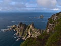 View of the coast of AndÃÂ¸ya island, VesterÃÂ¥len, Norway with rugged mountains and cliffs as well as bird rock BleiksÃÂ¸ya. Royalty Free Stock Photo