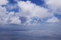 View from the coast of the Easter Island, of blue sky covered by white clouds, over the Pacific Ocean. Royalty Free Stock Photo