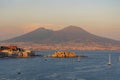 View of the coast in Naples and medieval Castel dell`Ovo on sunset. Tourism in Italy Royalty Free Stock Photo