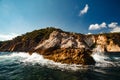 View of the coastal cliff with gulls from the open sea