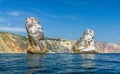 View on coastal cliffs, rock Orest and Pilad, cape Fiolent, Sevastopol Crimea. Bright sunny day, calm cristal clear blue sea. The