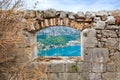 Window in old stone wall of medieval fortress. Royalty Free Stock Photo