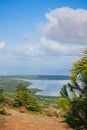 View of the coastline of the Atlantic Ocean on the island of Haiti. Green coastline turns into ocean. View from the mountain to