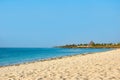 View of coastline with beach in Kenya, Africa. People, vacationers and sea with waves and surf, Buildings and resort under a blue Royalty Free Stock Photo