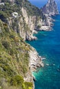 View of the coastline of the island of Capri, Italy, with one of its seaside rock formations known as the Faraglioni