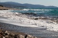 View at the coastline with pebble beach and water waves on the westside of Greek island Rhodes Royalty Free Stock Photo
