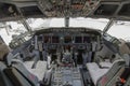 A view of the cockpit of a large commercial airplane a cockpit . Cockpit view of a aircraft cruising Control panel in a plane Royalty Free Stock Photo