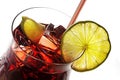 view into a cocktail glass, red mixed drink from cherries, berries, ice and lime, with or without alcohol, white background Royalty Free Stock Photo