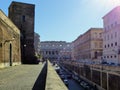 View of the Colosseum seen at the end of a street in Rome in Italy