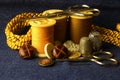 GOLDEN CORD WITH YELLOW THREAD ON REELS, BUTTONS AND SEWING AIDS Royalty Free Stock Photo