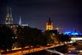 View of Cologne Dom Cathedral and Great St Martin Church at night from the chocolate museum, Germany Royalty Free Stock Photo