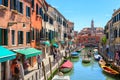 View of the colorful canal Rio del Malcanton in Venice on a sunny morning, Italy