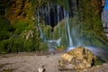 View of the colorful DreimÃÂ¼hlen waterfall in the Eifel