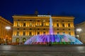 View of the colorful fountain and Palace of the Liguria region of De Ferrari Square by night in Genoa, Italy Royalty Free Stock Photo