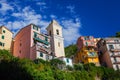 View of the colorful houses along the main street in a sunny day in Riomaggiore. Royalty Free Stock Photo